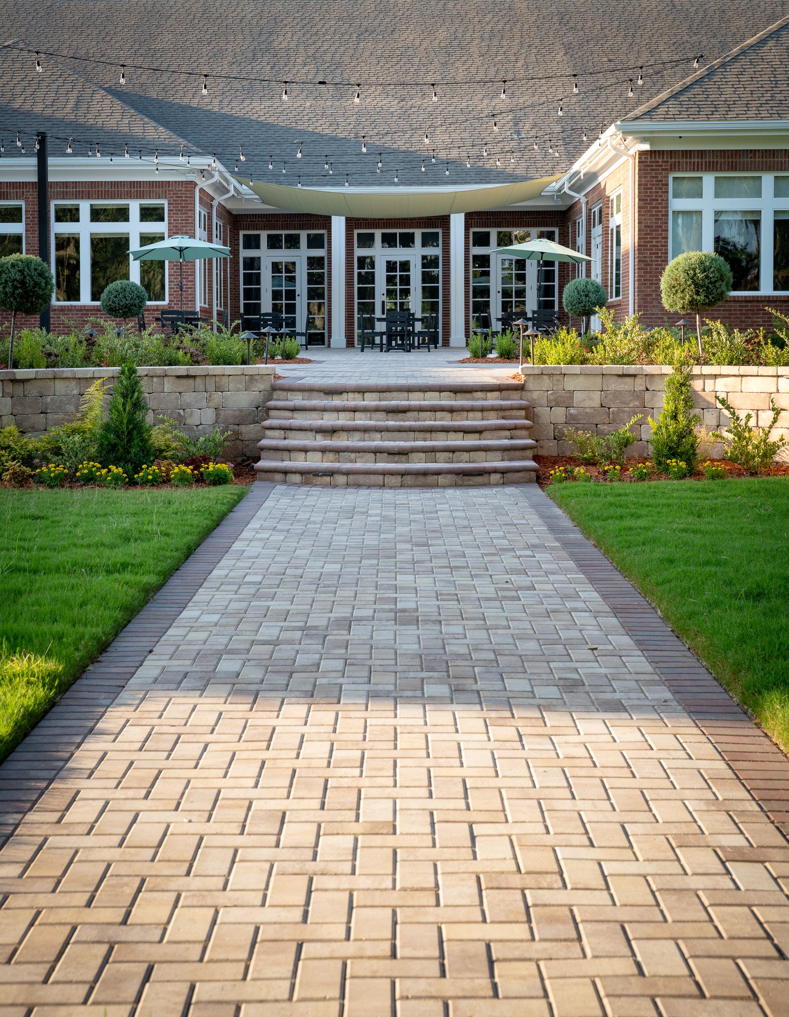 Commercial paver walkway with steps and retaining walls