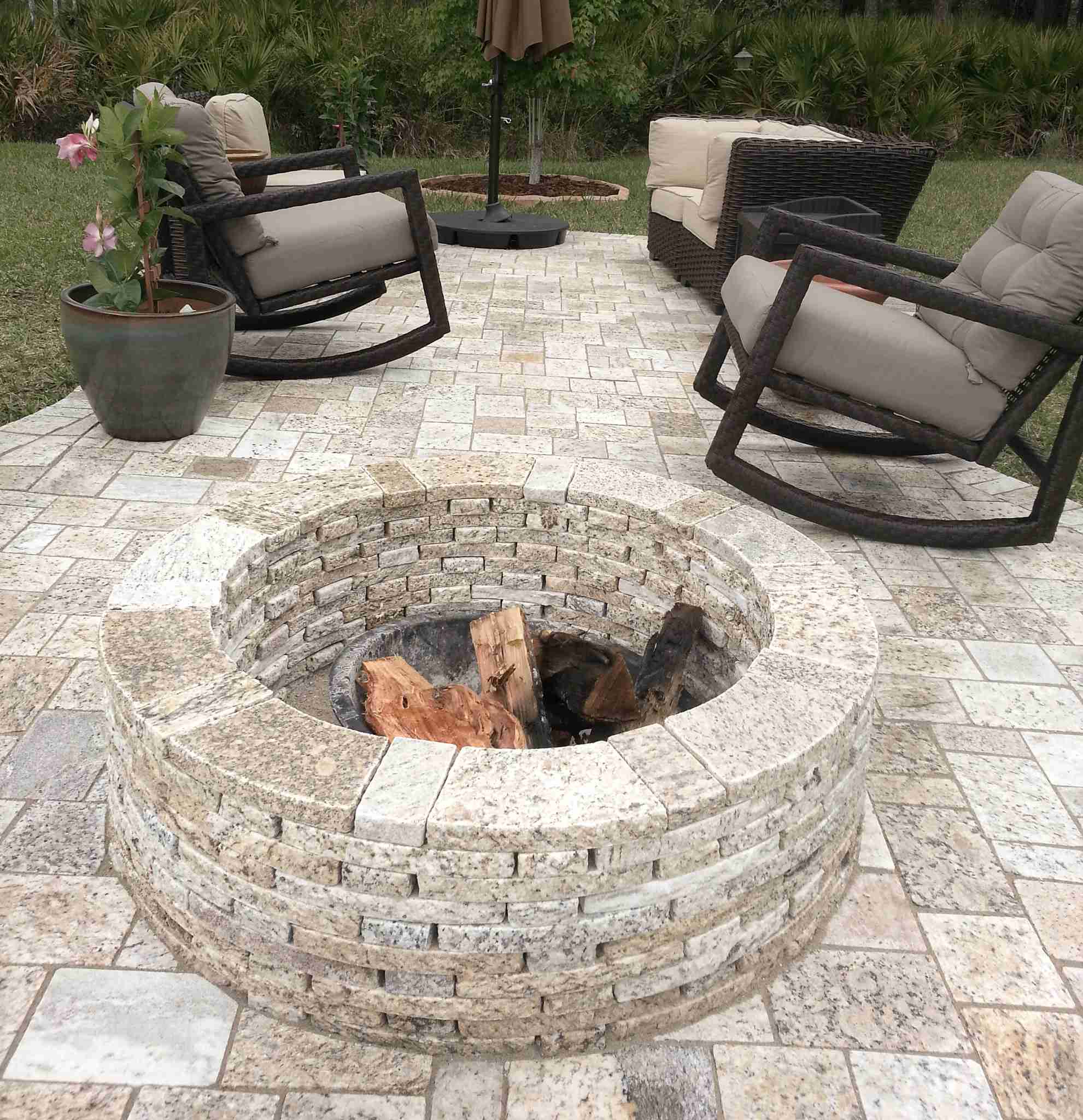 Paver patio with granite fire pit and rocking chairs