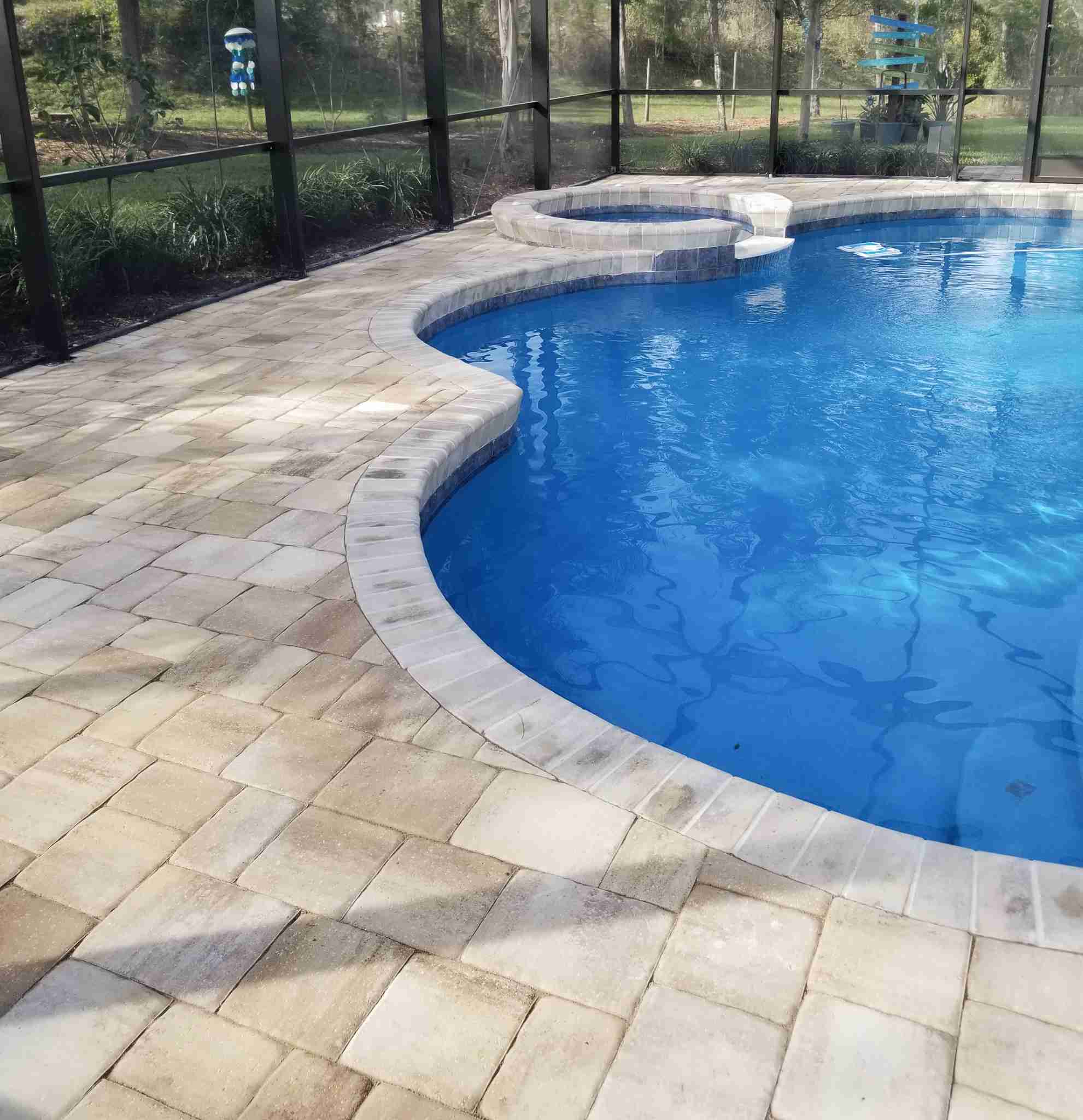 Paver pool deck with spa surround