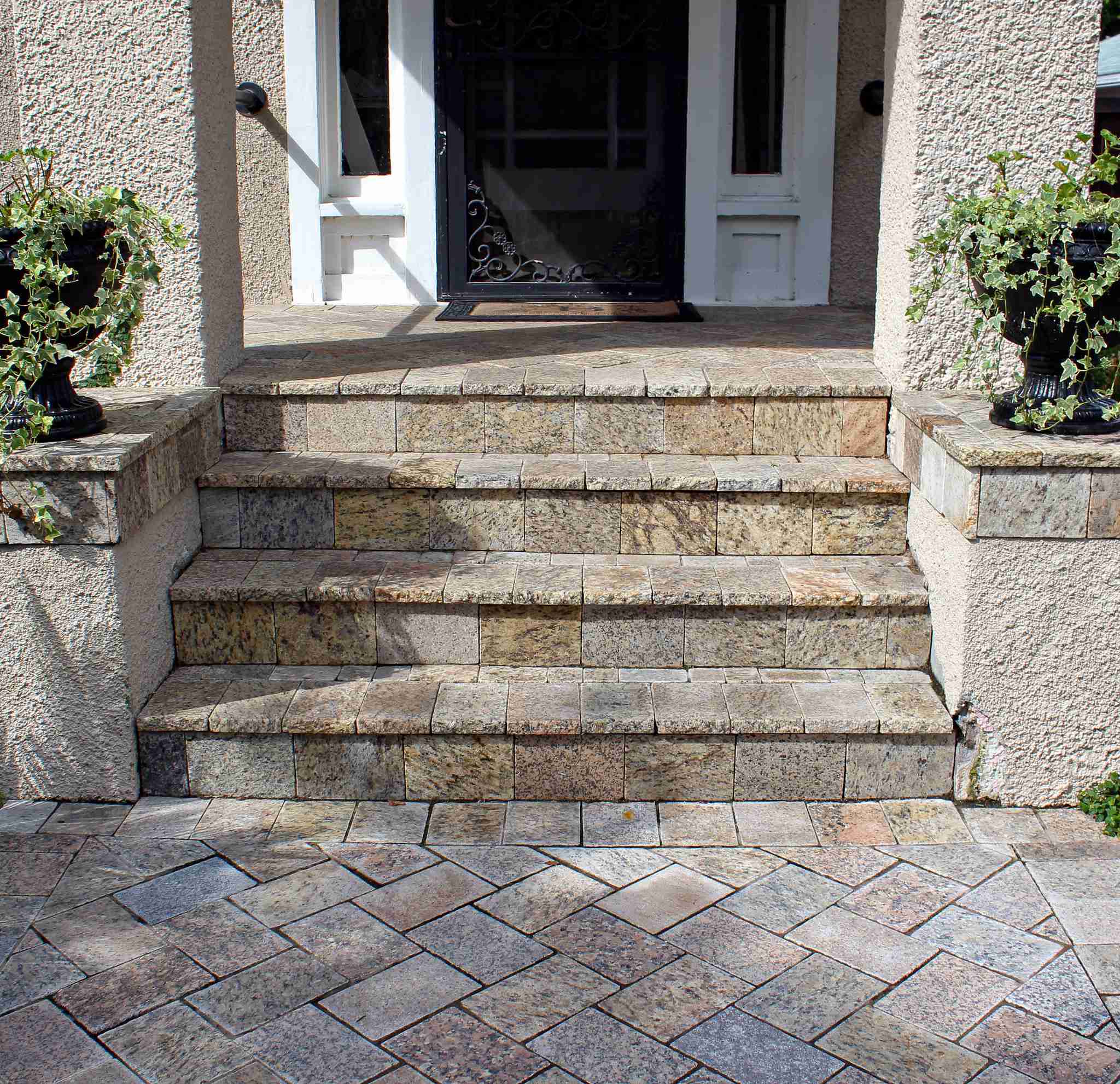 Front entry stone steps with paver walkway