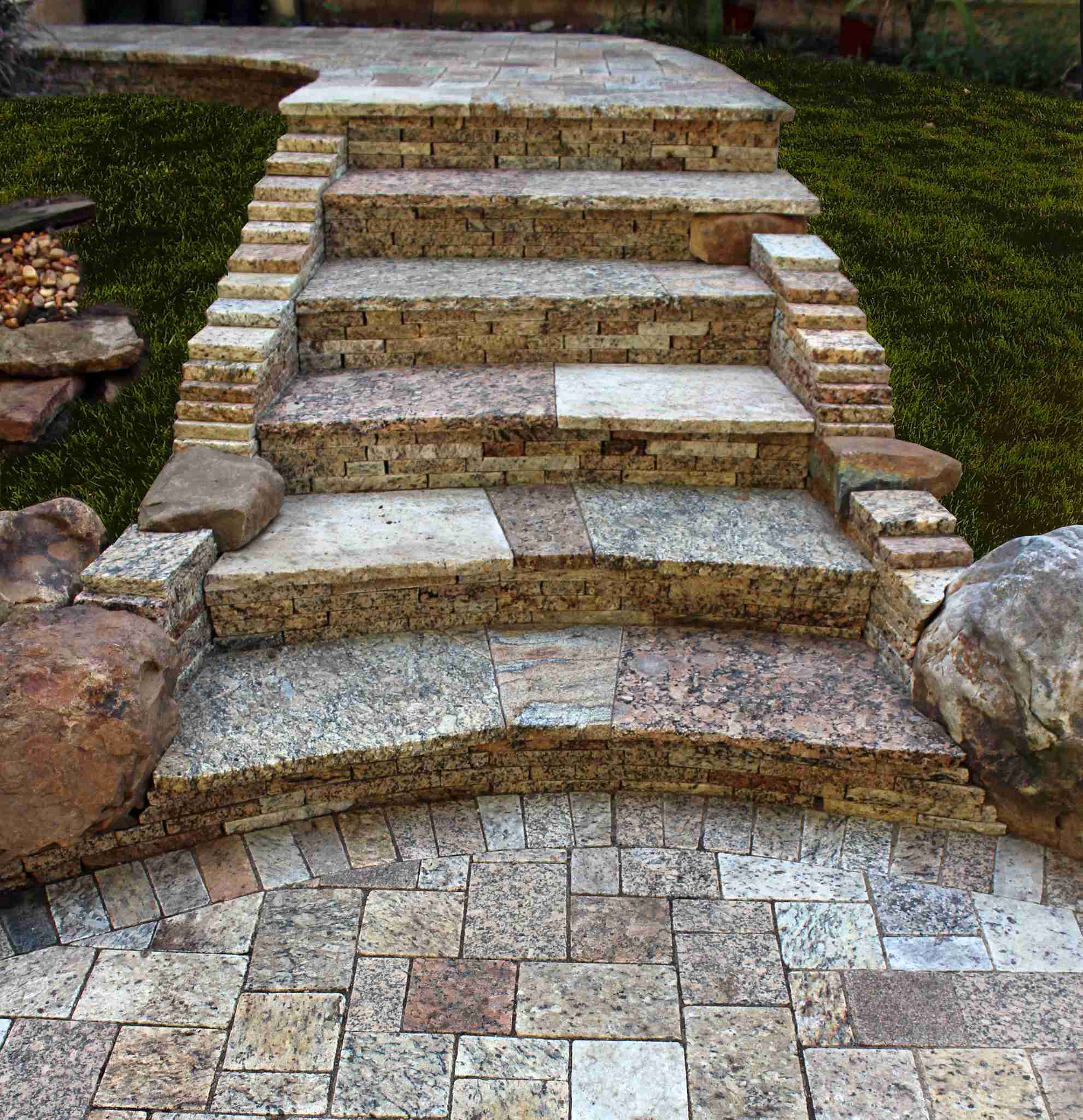 Natural stone steps with granite risers and paver landing